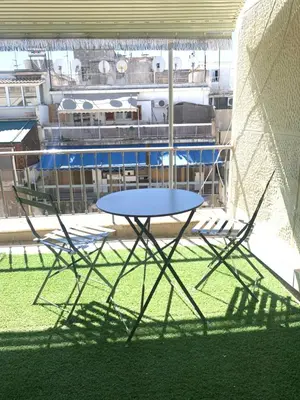 a table and chairs sitting on top of a building at Athens City Themis 9 in Athens