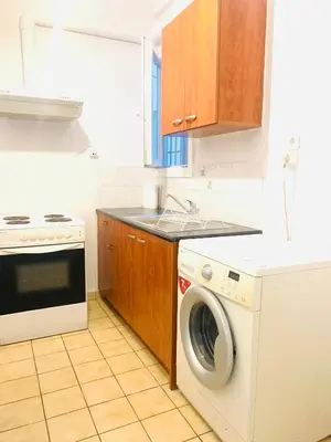 a kitchen with a washing machine and a stove at Athens City Themis 9 in Athens