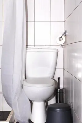 a white toilet in a bathroom with a window at Loft at historical center of Athens Acropolis View in Athens
