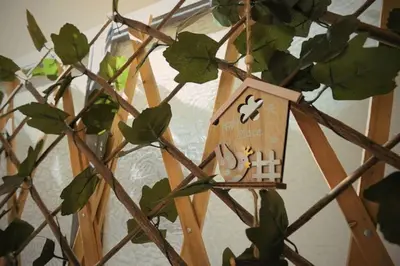 a tree with a wooden bird house on it at Cozy Apartment in the heart of Athens! in Athens
