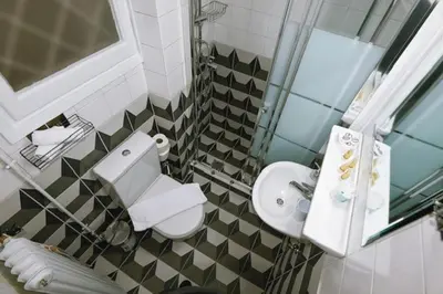 a bathroom with a toilet and a sink at Cozy Apartment in the heart of Athens! in Athens
