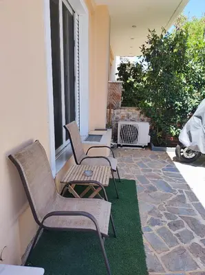 two chairs and a table on a patio at Pegasus cosy house in Athens