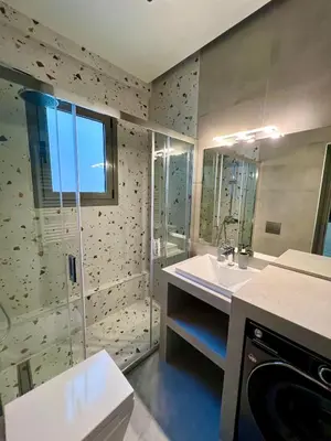 a bathroom with a sink and a shower at Smart Lux Apartment A in Athens