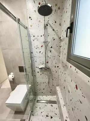 a bathroom with a shower and a toilet at Smart Lux Apartment A in Athens