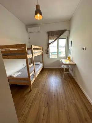 a room with two bunk beds and a desk at Harmony Luxury Grand Suite in Athens