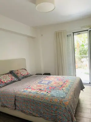 a bedroom with a bed and a window at A comfortable apartment to you in Athens