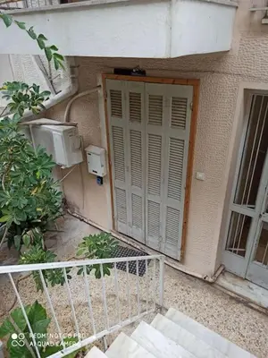 a door on the side of a building at A comfortable apartment to you in Athens