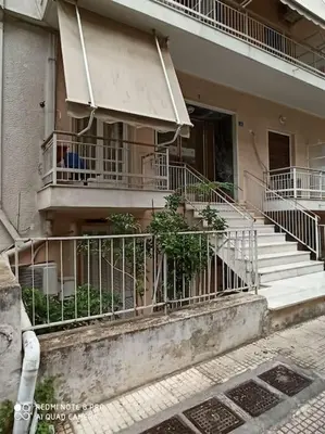 a building with balconies and stairs in front of it at A comfortable apartment to you in Athens