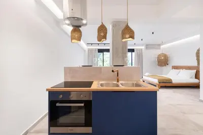 a kitchen with a sink and a stove top oven at Nana's Residence in Athens