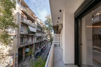 an apartment balcony with a view of a street at Nana's Residence in Athens