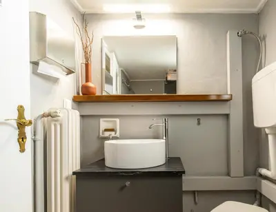 a bathroom with a sink and a mirror at Acropolis, Falirou in Athens