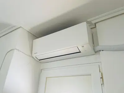a ceiling mounted air conditioner in a room at Top floor apartment in Athens