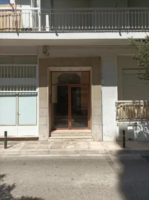 a front door of a building with a glass door at Calypso in Athens