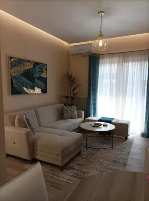 a living room with a couch and a table at Calypso in Athens