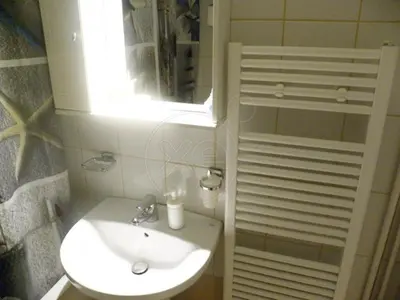 a bathroom with a sink and a mirror at Staying besides Acropolis! in Athens