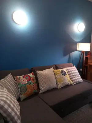 a couch with pillows on it in a living room at Staying besides Acropolis! in Athens