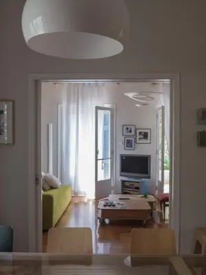 a living room with a couch and a table at 90m2 lovely 1-bedroom apartment in Paleo Faliro in Athens