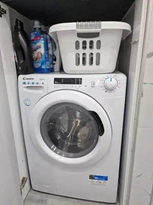 a washer and dryer in a small room at Luxury apartment in Attiki in Athens