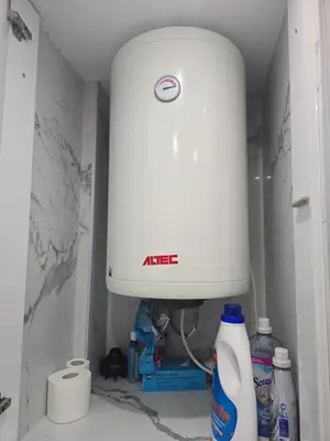 a kitchen with a white mixer in a bathroom at Luxury apartment in Attiki in Athens