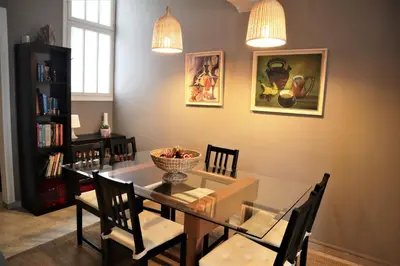 a dining room with a glass table and chairs at Amazing penthouse in Ambelokipi in Athens