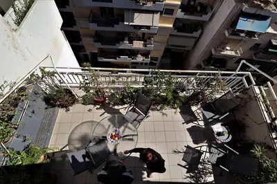 an overhead view of a building with plants at Amazing penthouse in Ambelokipi in Athens