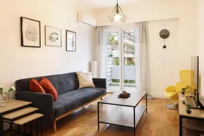 a living room with a couch and a table at Comfort & Relax apartment in Athens Riviera in Athens