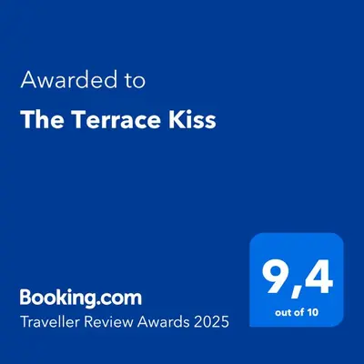 a blue screen with the text awarded to the terrace kiss at Comfort & Relax apartment in Athens Riviera in Athens