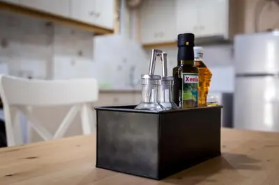 a black container with bottles of alcohol on a table at Glyfada 2 bedrooms 4 persons apartment by MPS in Athens