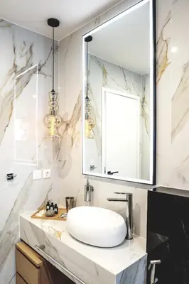 a bathroom with a sink and a mirror at EcoStay - Infinity business class 2BDR apartment by the sea in Alimos in Athens