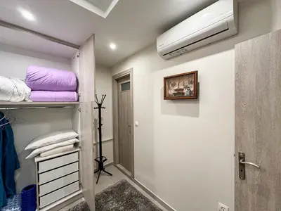 a room with a closet with a air conditioner at Contemporary & Spacious Renovated Apartment, DT Syntagma, /Touristic Area in Athens