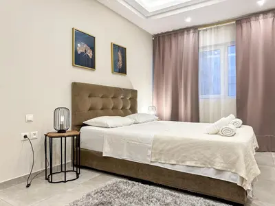 a bedroom with a large bed and a window at Contemporary & Spacious Renovated Apartment, DT Syntagma, /Touristic Area in Athens