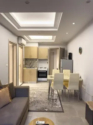 a living room with a couch and a table at Contemporary & Spacious Renovated Apartment, DT Syntagma, /Touristic Area in Athens