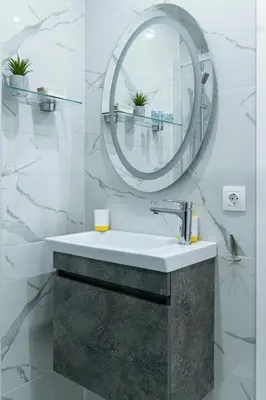 a bathroom with a sink and a mirror at King Davids Suite Athens finest! in Athens