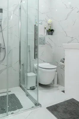a bathroom with a toilet and a glass shower at King Davids Suite Athens finest! in Athens