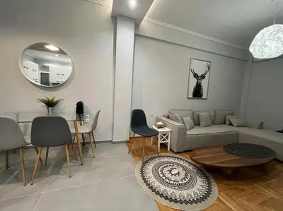 a living room with a couch and a table at Acropolis Casa 2bdr/2bthr w/hot tub-3mins to plaka in Athens