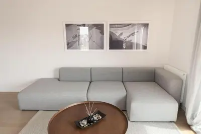 a living room with a couch and a table at Brand-new flat with a city view (FORM_G1) in Athens
