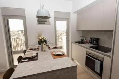 a kitchen with a table and a counter top at Brand-new flat with a city view (FORM_G1) in Athens