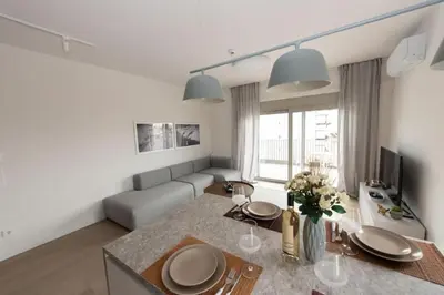 a living room with a table and a couch at Brand-new flat with a city view (FORM_G1) in Athens