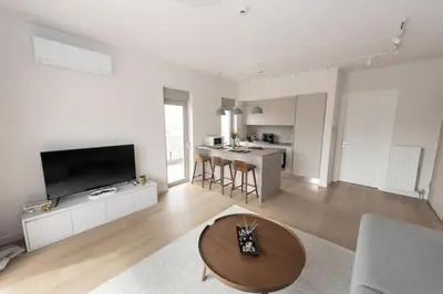 a living room with a couch and a table at Brand-new flat with a city view (FORM_G1) in Athens