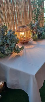 a table with a white table cloth and a basket at 115m2 K.G HOME in Athens