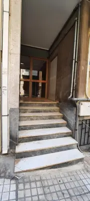 a set of stairs in front of a building at Taratsaki in Athens