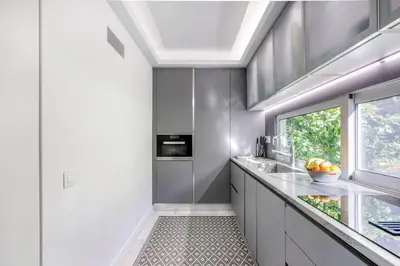 a kitchen with a sink and a window at South Blue Luxury Apartment in Vouliagmeni in Athens