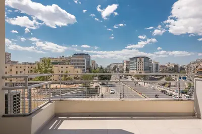 a balcony with a view of a city at Stylish Luxury Apartment near Acropolis at Syngrou-Fix metro station in Athens