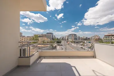 a balcony with a view of a city at Stylish Luxury Apartment near Acropolis at Syngrou-Fix metro station in Athens