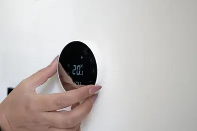 a person holding a light switch with their hand at Luna Apartment by A&D Properties in Porto Rafti