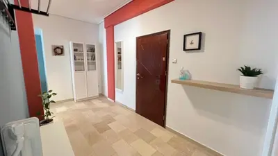 a hallway with a door and a hallway with a floor at Theseus Retreat 10 min walk from the Acropolis in Athens