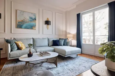 a living room with a couch and a table at Acropolis Museum Grand Residence in Athens