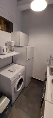 a kitchen with a washing machine and a washer at HoneyBee 3 - Cozy studio in the center of Athens in Athens