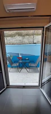 a view from a window of a patio with a table at HoneyBee 3 - Cozy studio in the center of Athens in Athens