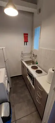 a small kitchen with a sink and a stove at HoneyBee 3 - Cozy studio in the center of Athens in Athens